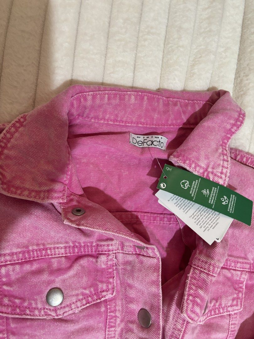DeFacto Pink Cropped Denim Jacket (Category: Coats, Jackets and Outerwear) located in Quezon City. Submitted by hadescloset (Listing ID 1468379745, Image 2). Description: - Brand: DeFacto - Condition: Brand new with original store tags attached - Color: Bright pink - Size: Small - Style: Cropped denim jacket with collar - Details: Front button closure, chest pockets, and silver-tone hardware.