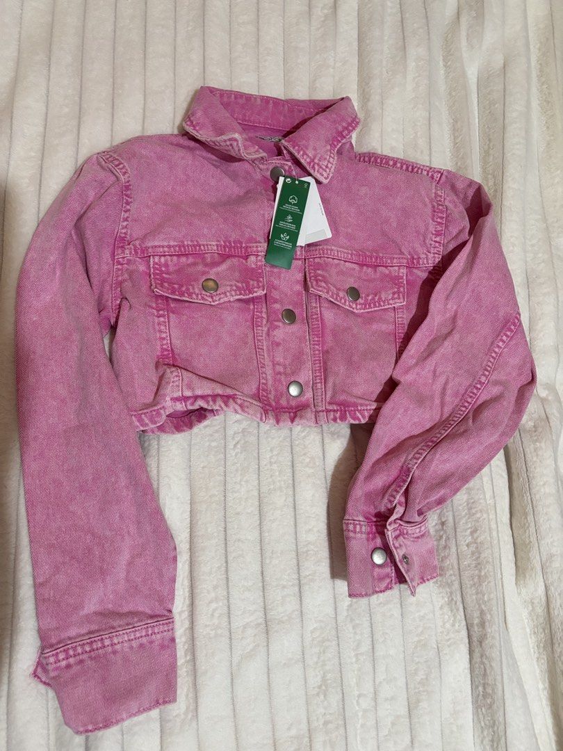 DeFacto Pink Cropped Denim Jacket (Category: Coats, Jackets and Outerwear) located in Quezon City. Submitted by hadescloset (Listing ID 1468379745, Image 1). Description: - Brand: DeFacto - Condition: Brand new with original store tags attached - Color: Bright pink - Size: Small - Style: Cropped denim jacket with collar - Details: Front button closure, chest pockets, and silver-tone hardware.