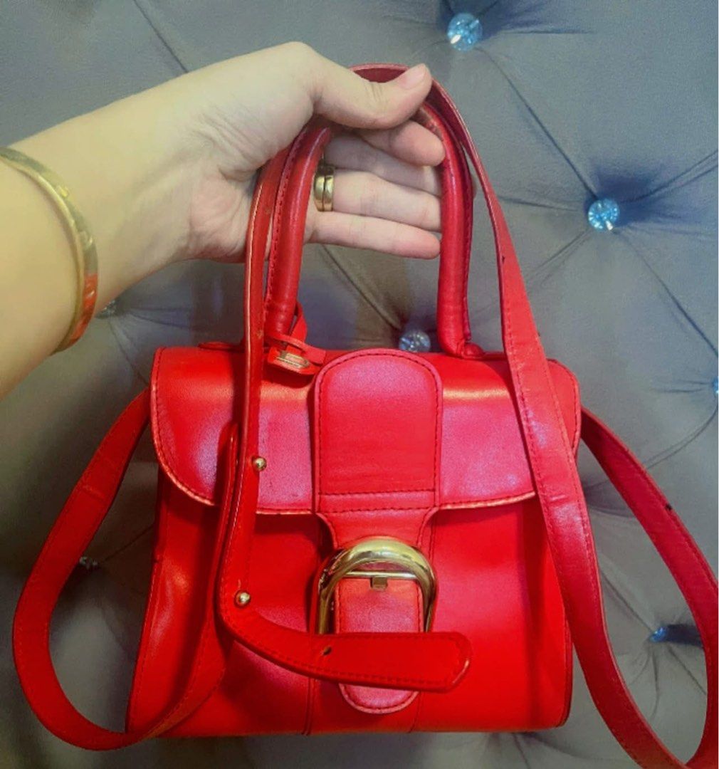Delvaux Brilliant Red (Category: Luxury Bags & Wallets) located in Roxas City. Submitted by lynngreyartillero (Listing ID 1468412406, Image 3). Description: Delvaux Brilliant Mini Rare Red❤️❤️❤️ Wala po syang bakbak yung handle nya is nangitim lng po dont know y sguro ksi gamit ang part nayan ng may ari✅✅✅ Pwd lagyan twilly po ❤️❤️❤️ Sign of used sympre ukay source preloved item sa leather din po pero super ganda pa nito mga madaaaam ❤️❤️❤️🔥🔥🔥