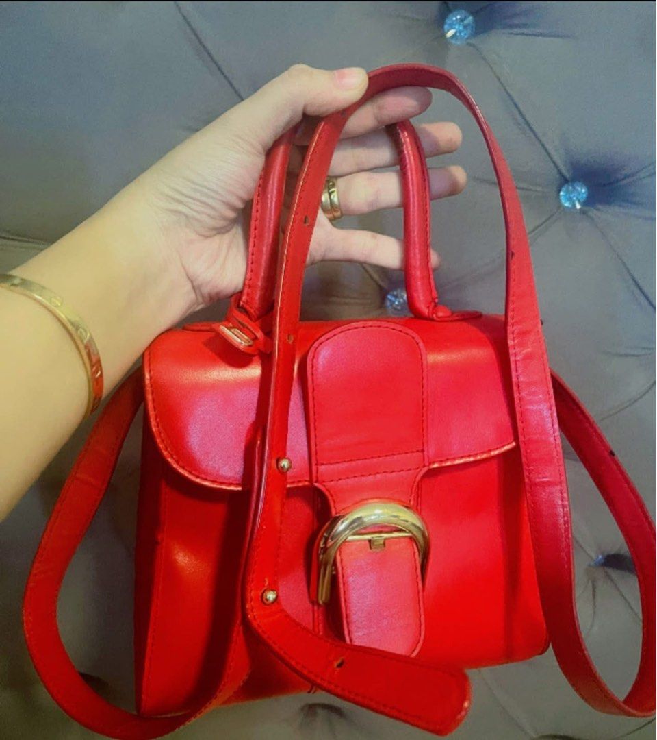 Delvaux Brilliant Red (Category: Luxury Bags & Wallets) located in Roxas City. Submitted by lynngreyartillero (Listing ID 1468412406, Image 1). Description: Delvaux Brilliant Mini Rare Red❤️❤️❤️ Wala po syang bakbak yung handle nya is nangitim lng po dont know y sguro ksi gamit ang part nayan ng may ari✅✅✅ Pwd lagyan twilly po ❤️❤️❤️ Sign of used sympre ukay source preloved item sa leather din po pero super ganda pa nito mga madaaaam ❤️❤️❤️🔥🔥🔥