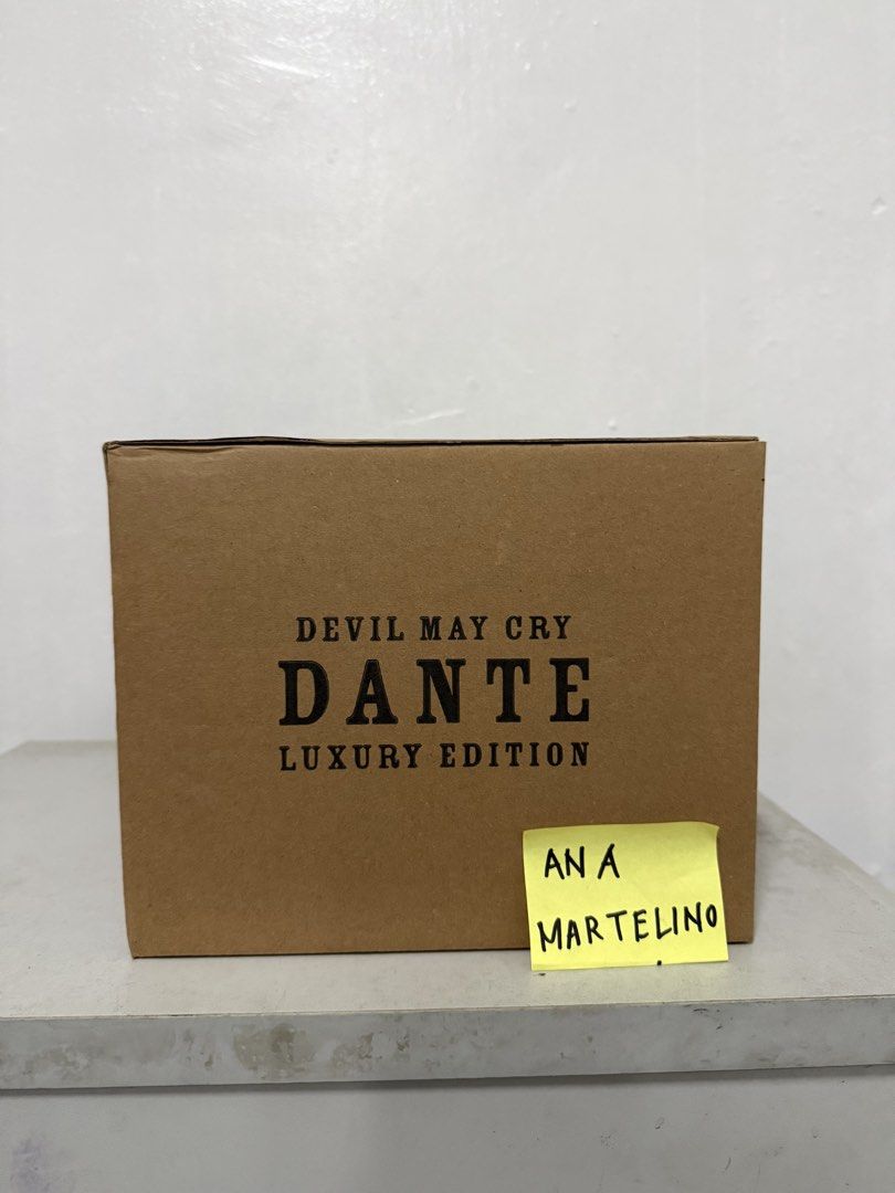 Devil May Cry 5 Dante Luxury Edition 1/6 Action Figure (Category: Figurines & Statues) located in Manila. Submitted by ana_banana011 (Listing ID 1468307615, Image 3). Description: - Brand: Asmus Toys (1/6 scale) - Item: Devil May Cry 5 Dante Luxury Edition - Condition: Brand new in original brown shipper box (unopened) - Special Features: Custom pizza slice and Dante silhouette graphics on box - Included Weapons & Accessories: Rebellion, Devil Sw