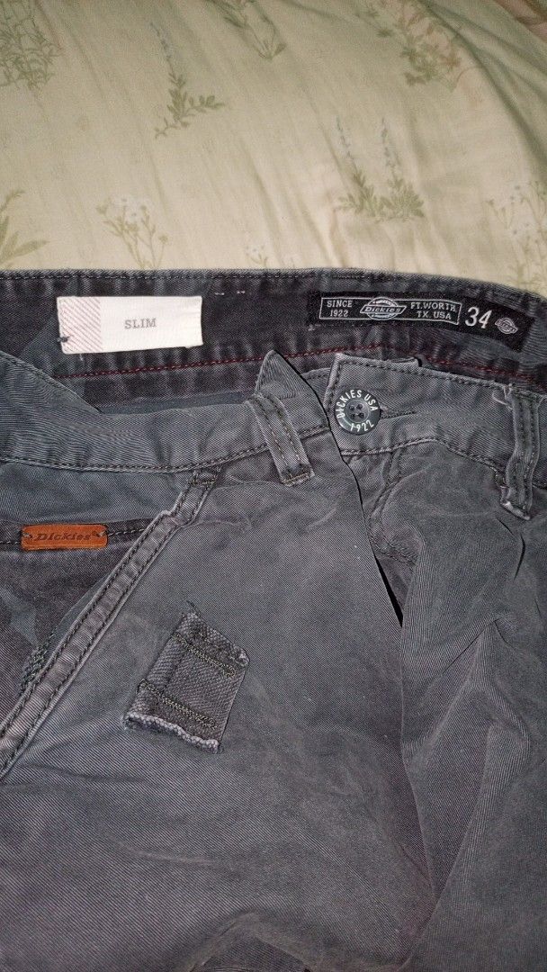 Dickies Life Slim Cargo Pants Dark Grey Size 34 (Category: Trousers) located in Manila. Submitted by rizu09 (Listing ID 1468408337, Image 2). Description: - Brand/Model: Dickies Life Slim Cargo Pants - Color: Dark Grey - Size: 34 Waist - Closure: Button closure - Pockets: Side cargo flaps with secure zip pockets - Details: Dickies logo patch on back pocket and inner waistband - Fit: Straight cut through the leg - Material: Durable cotton fabric.