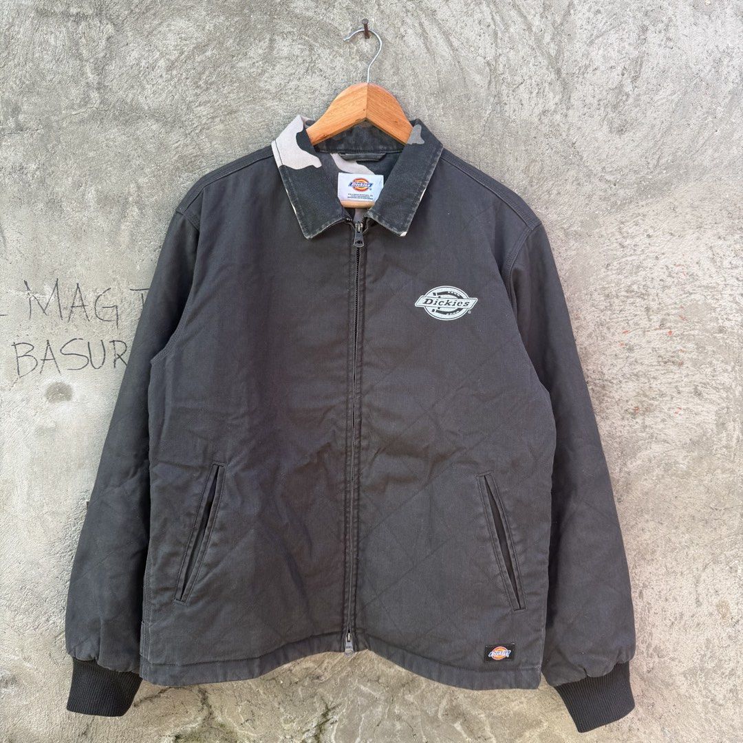 Dickies Quilted Work Jacket With Camo Collar (Category: Coats, Jackets and Outerwear) located in Caloocan City. Submitted by ayogorenia1002 (Listing ID 1468350099, Image 1). Description: - Brand: Dickies - Color: Black canvas with camo pattern on the collar - Lining: Quilted for extra warmth - Details: Embroidered chest logo, small patch on cuff, Williamson-Dickie neck tag - Pockets: Two front welt pockets - Cuffs & Hem: Ribbed for a snug fit - H