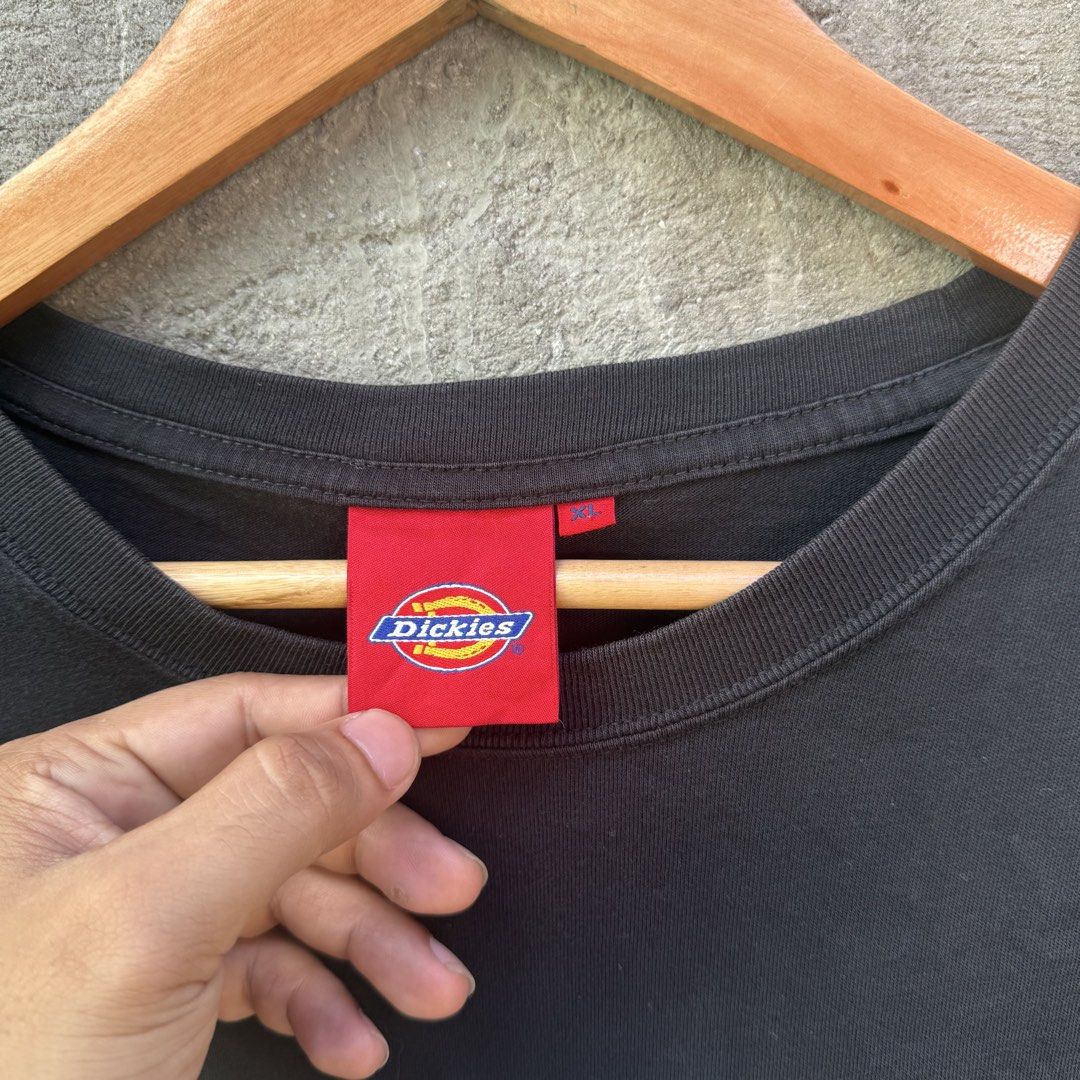 Dickies "With Dickies" Black Graphic Tee Size XL (Category: Tshirts & Polo Shirts ) located in Caloocan City. Submitted by ayogorenia1002 (Listing ID 1468350846, Image 3). Description: - Brand: Dickies - Color: Black - Size: XL (Classic Fit) - Material: 100% Cotton - Design: Large white logo graphic with "WITH DICKIES" text on the lower front - Accents: Red Dickies woven label tags on the collar and sleeve hem - Condition: Brand new / Excellent q