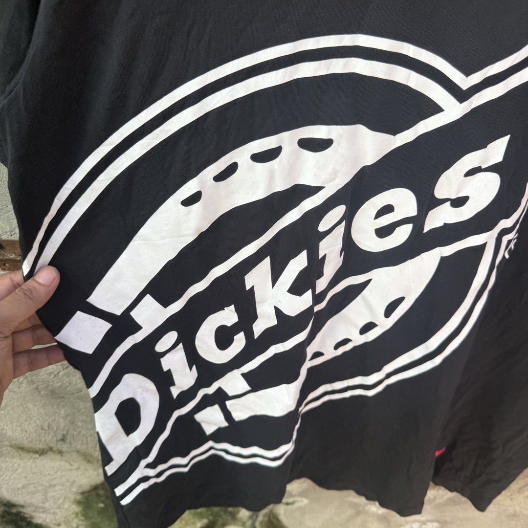Dickies "With Dickies" Black Graphic Tee Size XL (Category: Tshirts & Polo Shirts ) located in Caloocan City. Submitted by ayogorenia1002 (Listing ID 1468350846, Image 2). Description: - Brand: Dickies - Color: Black - Size: XL (Classic Fit) - Material: 100% Cotton - Design: Large white logo graphic with "WITH DICKIES" text on the lower front - Accents: Red Dickies woven label tags on the collar and sleeve hem - Condition: Brand new / Excellent q
