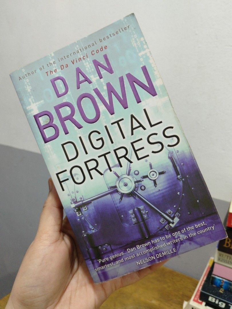 Digital Fortress by Dan Brown Paperback Novel (Category: Storybooks) located in Bocaue. Submitted by wendyiv (Listing ID 1468486250, Image 1). Description: - Title: Digital Fortress by Dan Brown - Genre: Techno-thriller about the NSA and a mysterious code - Format: Standard paperback - Condition: Spine intact, pages clean with no markings, and minor shelf wear on the cover, minor loose pages - Note: Page edges show natural yellowing due to age.