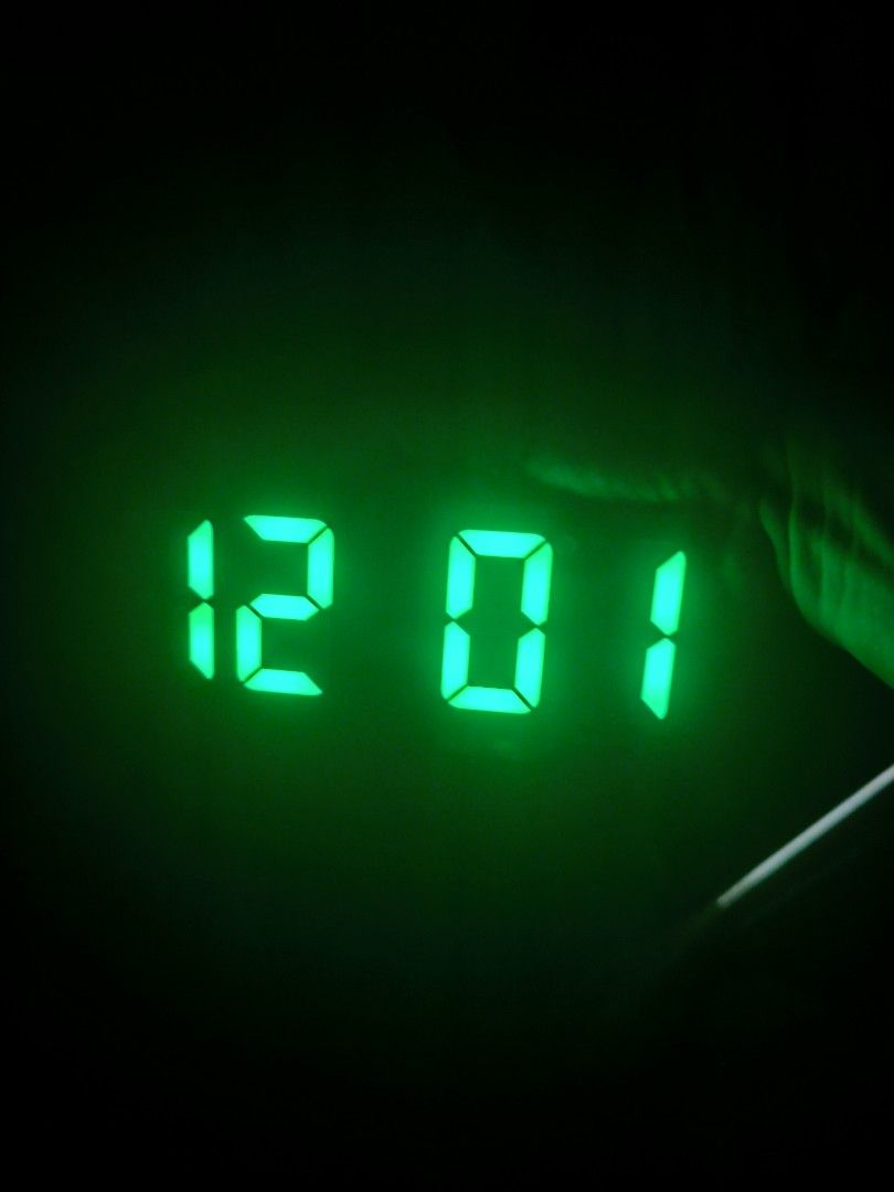 Digital LED Alarm Clock with Green Display (Category: Clocks) located in Angeles City. Submitted by yellowbrickstore (Listing ID 1468351569, Image 3). Description: - Clear LED display with bright green numbers visible in both dark and well-lit rooms - Sleek black rectangular body that fits any room aesthetic - Dual power supply: works with AAA batteries or DC power - Convenient top-mounted buttons for easy time and alarm settings no battery cover