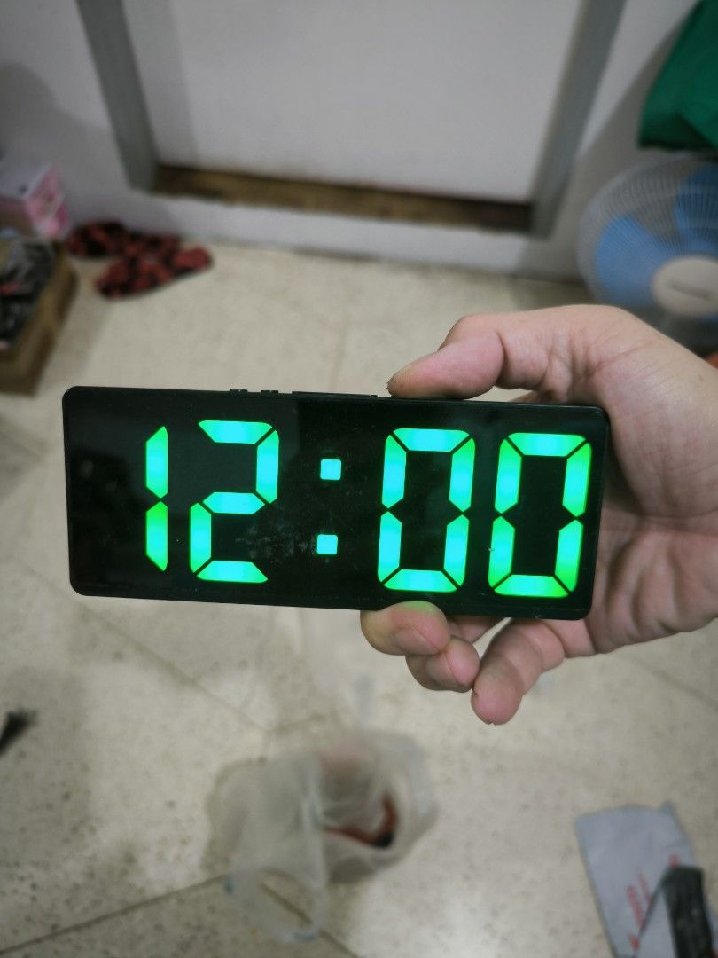Digital LED Alarm Clock with Green Display (Category: Clocks) located in Angeles City. Submitted by yellowbrickstore (Listing ID 1468351569, Image 1). Description: - Clear LED display with bright green numbers visible in both dark and well-lit rooms - Sleek black rectangular body that fits any room aesthetic - Dual power supply: works with AAA batteries or DC power - Convenient top-mounted buttons for easy time and alarm settings no battery cover