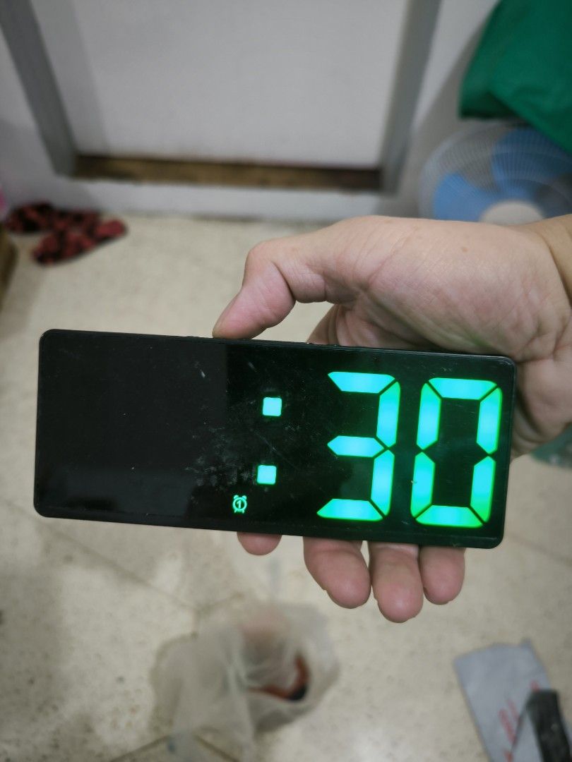 Digital LED Alarm Clock with Green Display (Category: Clocks) located in Angeles City. Submitted by yellowbrickstore (Listing ID 1468351569, Image 2). Description: - Clear LED display with bright green numbers visible in both dark and well-lit rooms - Sleek black rectangular body that fits any room aesthetic - Dual power supply: works with AAA batteries or DC power - Convenient top-mounted buttons for easy time and alarm settings no battery cover