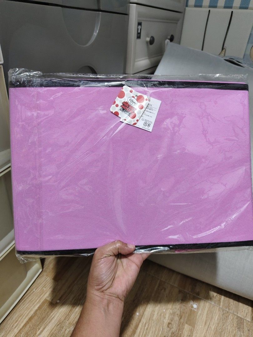 Disney Minnie Mouse Craft Room Storage Box (Category: Storage Boxes & Baskets) located in Makati City. Submitted by abegailbrezuela (Listing ID 1468405233, Image 3). Description: - Authentic Disney Minnie Mouse collapsible storage box - Features an adorable craft room graphic in pink fabric with black trim - Brand new, unused, with tag attached in original plastic wrapping - Dimensions: approx. 38 x 26 x 26 cm - Perfect for organizing toys, cloth
