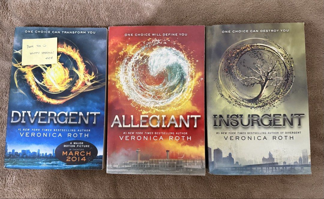 Divergent Series Trilogy Set by Veronica Roth (Category: Storybooks) located in Manila. Submitted by vaultfinds (Listing ID 1468266931, Image 1). Description: Divergent, Insurgent, and Allegiant paperback books by Veronica Roth. Three dystopian novels together. Great YA read. Covers in good shape, normal shelf wear. Read once, sitting on the shelf..