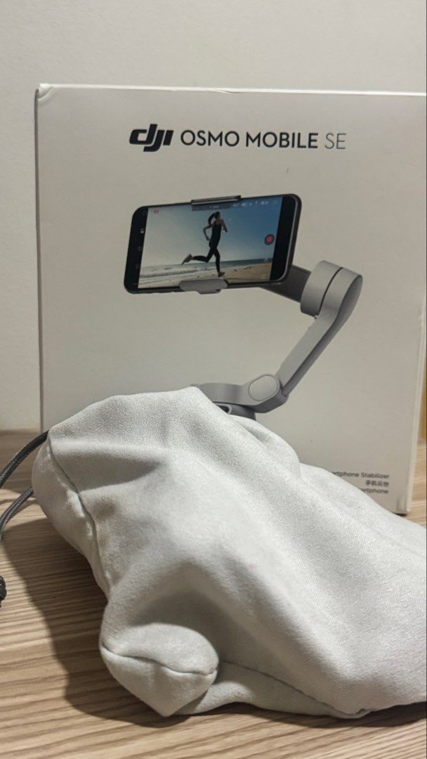 DJI Osmo Mobile SE Smartphone Stabilizer (Category: Gimbals & Stabilizers ) located in Mandaluyong City. Submitted by kimkhaye14 (Listing ID 1468390334, Image 1). Description: - Item: DJI Osmo Mobile SE Phone Gimbal - Condition: Barely used, basically untouched and like new - Key Features: Professional stabilization for smooth videos, quick magnetic mount setup - Ideal For: Vlogging, mobile cinematography, and content creation - Inclusions: Mini 
