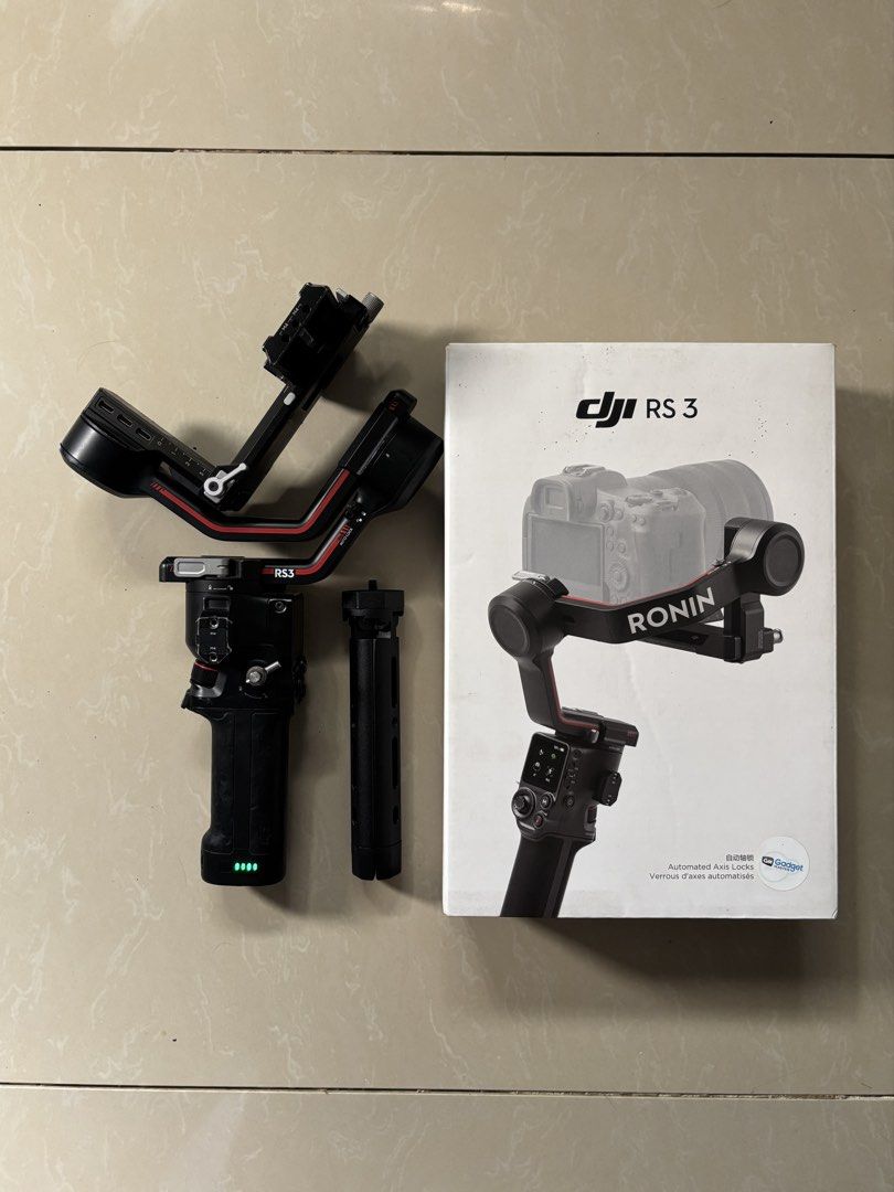 DJI RS 3 Gimbal with Box (Category: Gimbals & Stabilizers ) located in Manila. Submitted by davejudan (Listing ID 1468299195, Image 1). Description: Condition: Fully functional with minor cosmetic scuffs; screen and buttons are clean and responsive With box Brand new generic stand All locks & motors still working With minor scratches due to usage Rubber peelings in battery grip Bought 24,500 Selling 11,500 Issue: wobble in roll axis but still ver