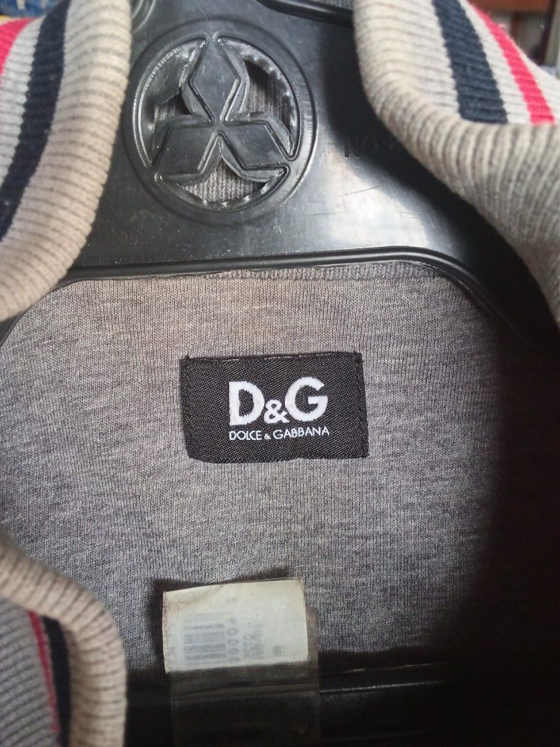 Dolce Gabbana zip up (Category: Coats, Jackets and Outerwear) located in Manila. Submitted by tcbukay_zxc25 (Listing ID 1468336907, Image 2). Description: dolce Gabbana zip up jacket size 48 M good condition issue check pic 1 pinhole.