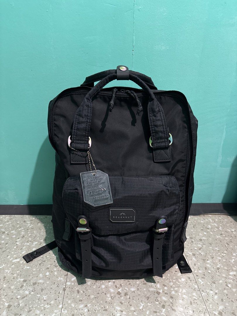 DOUGHNUT MACAROON GAMESCAPE SERIES (original) (Category: Backpacks) located in Quezon City. Submitted by gamitnirod (Listing ID 1468356459, Image 2). Description: -Color: Black (Deep/neat black) -Size: 17in x 11.5in x 5 -No issue, no damage -Perfect for daily use or light travel -With padded laptop compartment up to 14’ -2 inner (with garter) and 2 outer side pockets for umbrella or tumbler -Multiple inner mini pockets -1 secured pocket behind fo