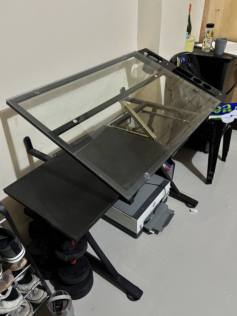 Drafting Table/ Drawing Table For Sale w/ Chair (Category: Tables & Sets) located in Baguio. Submitted by tenten.151 (Listing ID 1468351247, Image 3). Description: Selling my pre-loved drafting table, ideal for students, artists, architecture students, and anyone who enjoys drawing or sketching. Details: Comes with drawers for storage Suitable for drafting, drawing, and other art-related work Pre-loved condition Condition: Missing two screws from