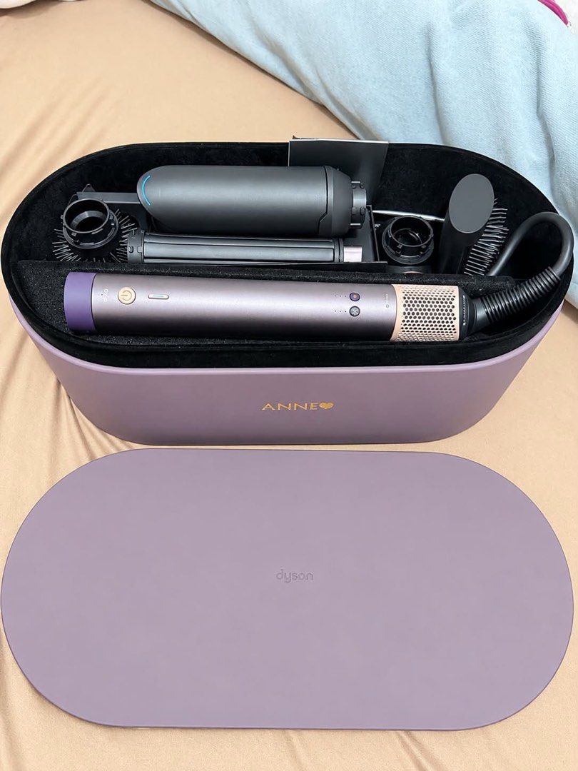 Dyson Airwrap Co-anda 2x Straight + Wavy (Category: Hair) located in Taguig. Submitted by declutteringworldbyLei (Listing ID 1468469553, Image 2). Description: Authentic Dyson Airwrap Co-anda 2x (Straight & Wavy Set) - Color: Purple and Rose Gold - Purchased from SM MOA - Condition: Rarely used, like new - Complete with all attachments, original presentation case, and box - Price: ₱28,000 - Meetup locations: Makati or Taguig area - Message us if 