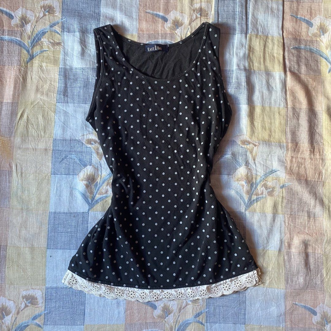 East Boy Black Polka Dot Tank Top (Category: Sleeveless) located in Santiago. Submitted by dear_darlingdoll (Listing ID 1468406165, Image 1). Description: - Brand: East Boy - Design: Black with all-over white polka dots - Details: Scoop neckline and white eyelet lace trim along the bottom hem - Fit: Fitted cut - Material: Soft and comfortable cotton - Condition: Excellent.