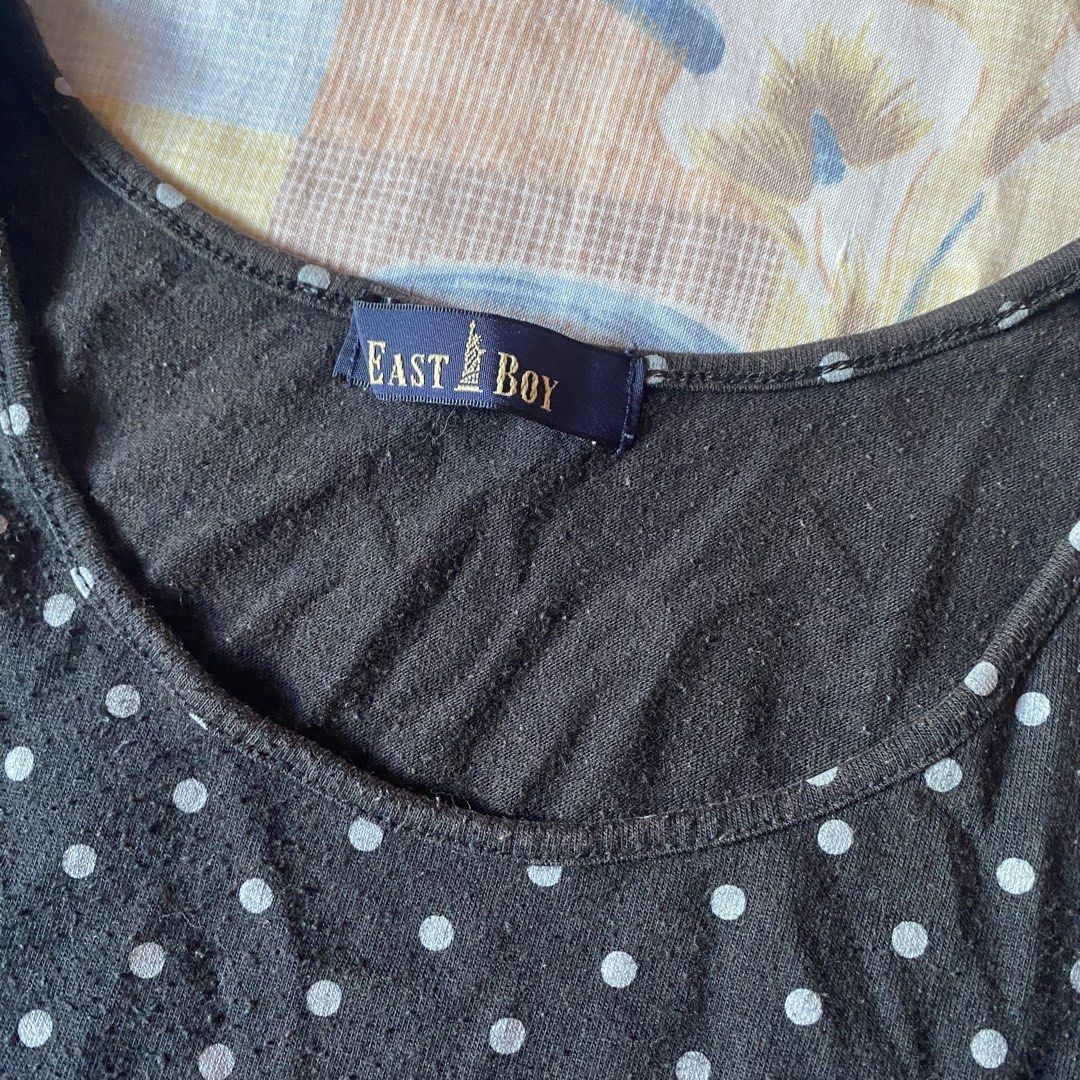 East Boy Black Polka Dot Tank Top (Category: Sleeveless) located in Santiago. Submitted by dear_darlingdoll (Listing ID 1468406165, Image 3). Description: - Brand: East Boy - Design: Black with all-over white polka dots - Details: Scoop neckline and white eyelet lace trim along the bottom hem - Fit: Fitted cut - Material: Soft and comfortable cotton - Condition: Excellent.