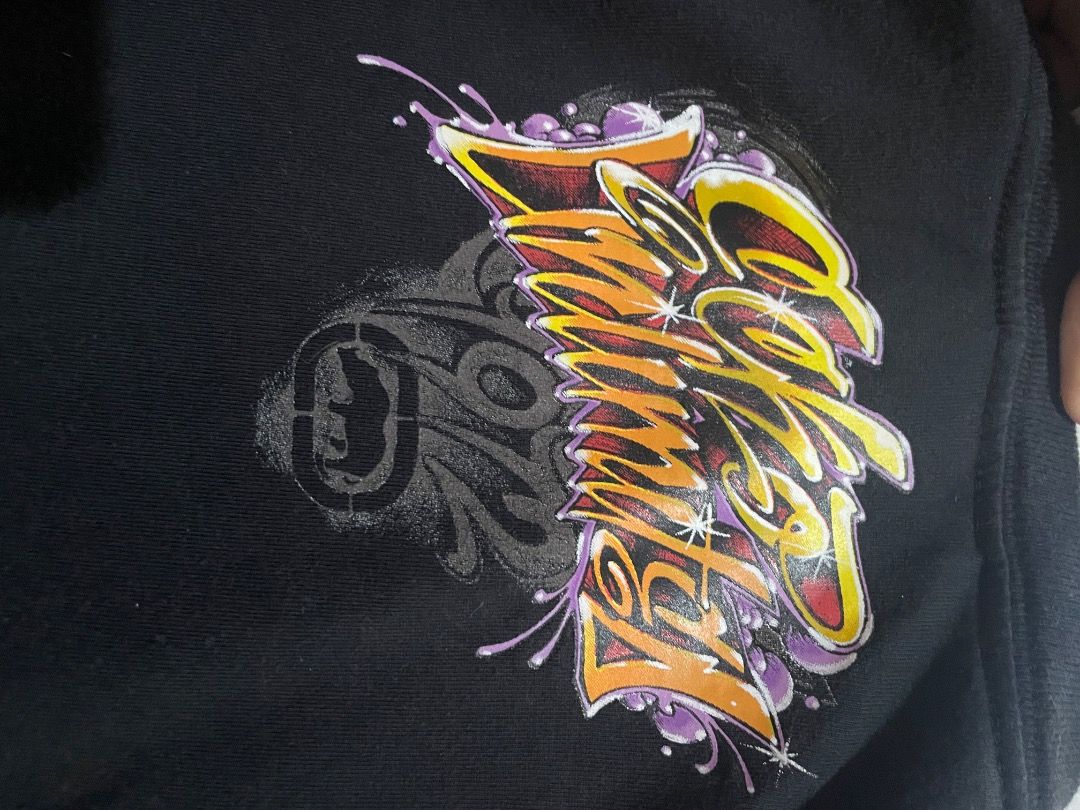 Ecko Untd graffiti (Category: Formal Shirts) located in Caloocan City. Submitted by whirshie (Listing ID 1468314765, Image 2). Description: - Brand: Ecko Unltd - measurements: 21.5x28-29 - Color: Black - Size: Medium - Material: 100% Cotton - Design: Large graffiti-style front print in gold, orange, and purple with iconic rhino logo - Details: Branded tape inside the collar - Condition: Excellent pre-loved condition - Perfect for streetwear and c