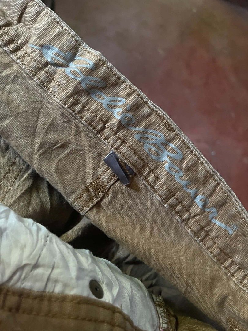 Eddie Bauer Brown Cargo Shorts Size 36 (Category: Shorts) located in Gumaca. Submitted by makuliti (Listing ID 1468307632, Image 3). Description: - Brand: Eddie Bauer - Color: Brown - Material: Sturdy canvas - Size: 36 - Design: Multiple utility pockets including side cargo and back patch pockets - Closure: Front button with belt loops - Condition: Excellent/Great for hiking, outdoor activities, and everyday casual wear.