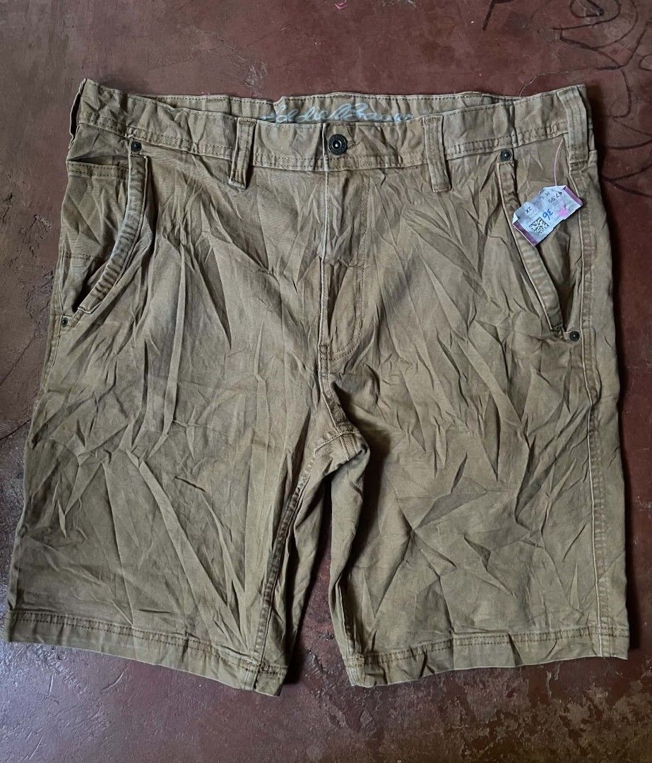 Eddie Bauer Brown Cargo Shorts Size 36 (Category: Shorts) located in Gumaca. Submitted by makuliti (Listing ID 1468307632, Image 2). Description: - Brand: Eddie Bauer - Color: Brown - Material: Sturdy canvas - Size: 36 - Design: Multiple utility pockets including side cargo and back patch pockets - Closure: Front button with belt loops - Condition: Excellent/Great for hiking, outdoor activities, and everyday casual wear.
