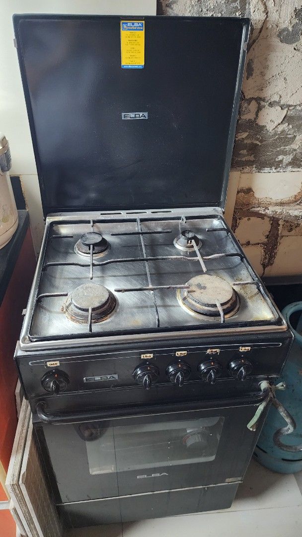 Elba Gas Stove with Oven (Category: Cookers) located in Quezon City. Submitted by christyso1209 (Listing ID 1468403462, Image 1). Description: - Brand/Model: Elba Gas Cooker - Color: Sleek Black - Burners: 4 gas burners for simultaneous cooking - Oven: Built-in oven underneath with a glass viewing window - Controls: Easy-to-use front panel control knobs - Condition: Used, well-maintained, and fully functional - Note: Compatible with standard gas 