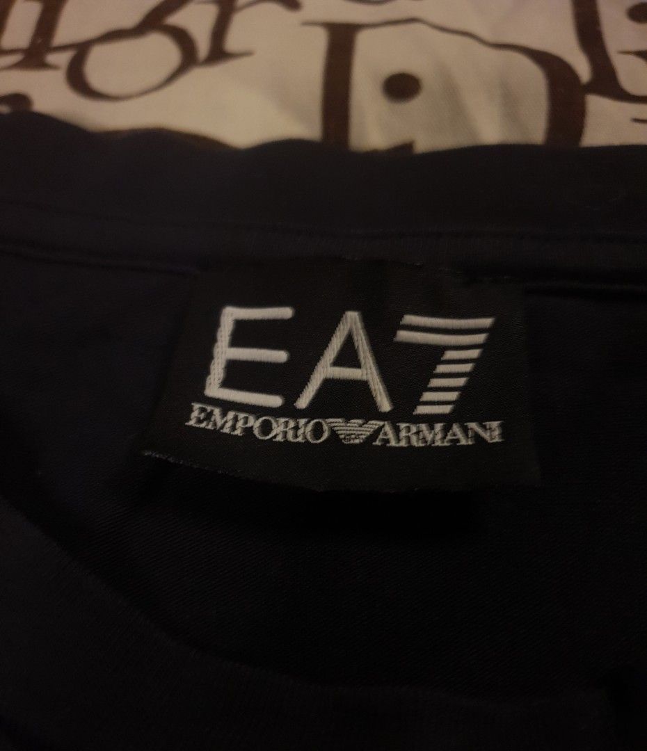 Emporio Armani (Category: Tshirts & Polo Shirts ) located in San Fernando. Submitted by retro.district. (Listing ID 1468464953, Image 3). Description: - Emporio Armani eagle design - Size: Large - Condition: Excellent - No issue.