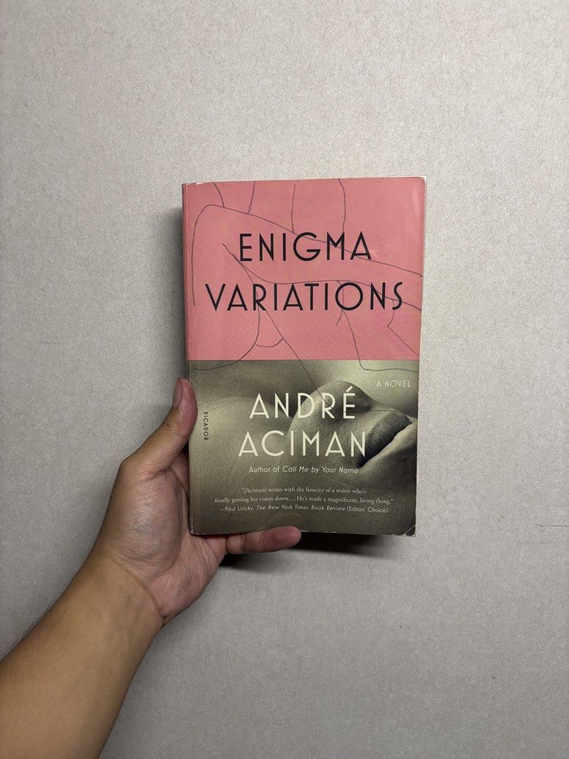 Enigma Variations by André Aciman (Category: Storybooks) located in Cabuyao City. Submitted by john.sellsthings (Listing ID 1468393869, Image 1). Description: - Title: Enigma Variations by André Aciman - Publisher/Format: Picador paperback with pink and grey cover art - Condition: Pages are slightly yellowed with age, has writing on title page, spine slightly cracked, tabs will be removed - Bonus: From the bestselling author of Call Me by Your Na