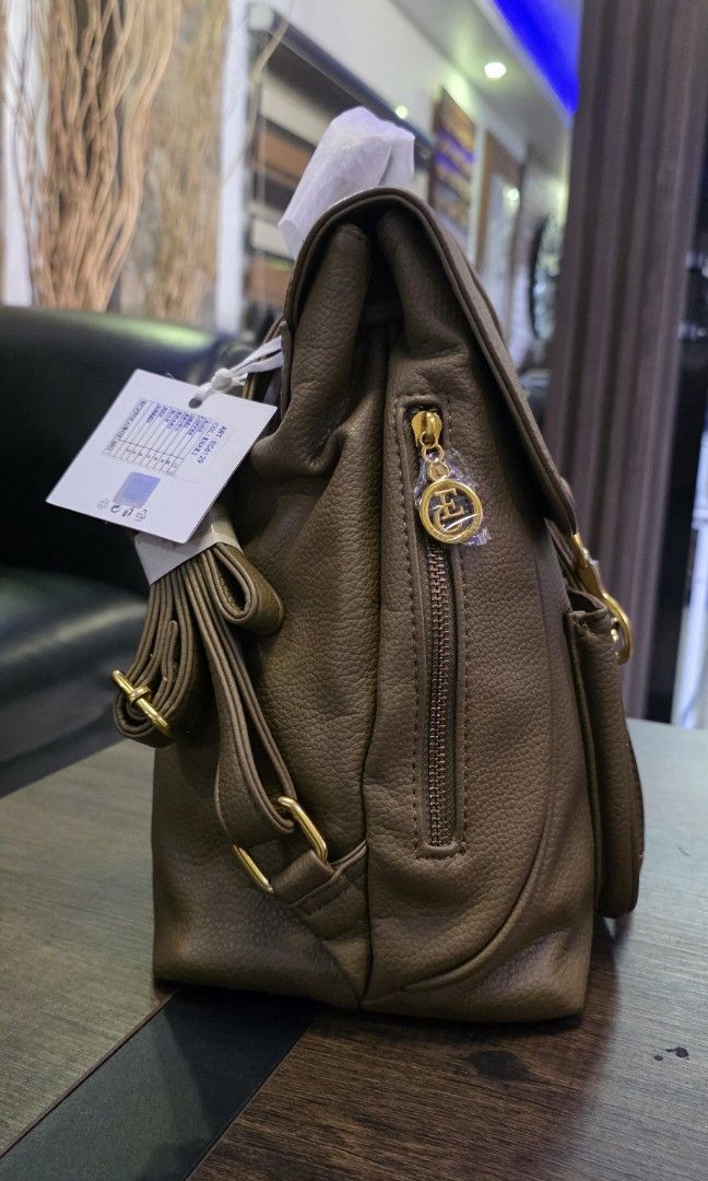 Enrico Coveri leather backbag (Category: Luxury Bags & Wallets) located in Apalit. Submitted by mjtwicedstyle_de_ap (Listing ID 1468330242, Image 2). Description: Brandnew with Tag Enrico Coveri from Italy. soft lrather medium size with taupe/brownish color.