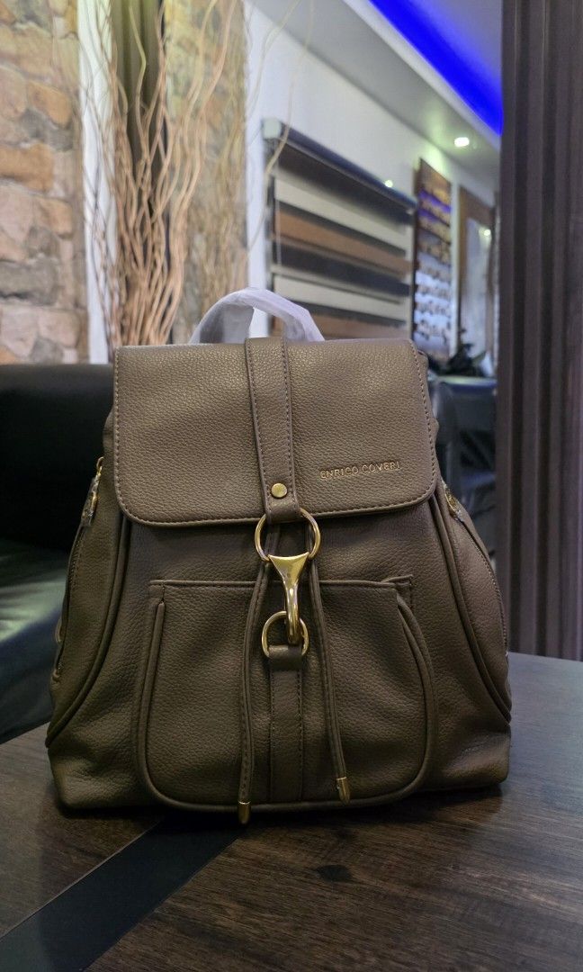 Enrico Coveri leather backbag (Category: Luxury Bags & Wallets) located in Apalit. Submitted by mjtwicedstyle_de_ap (Listing ID 1468330242, Image 1). Description: Brandnew with Tag Enrico Coveri from Italy. soft lrather medium size with taupe/brownish color.