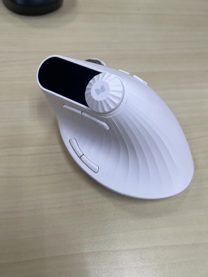 Ergonomic Vertical Wireless Mouse with Display Screen (Category: Mouse & Mousepads) located in Pasig City. Submitted by eggsfordinner (Listing ID 1468321394, Image 2). Description: - Color: Clean white - Ergonomic vertical design to reduce wrist strain - Built-in display screen at the top - Multiple side buttons with DPI adjustment and scroll wheels - Tested and working properly.