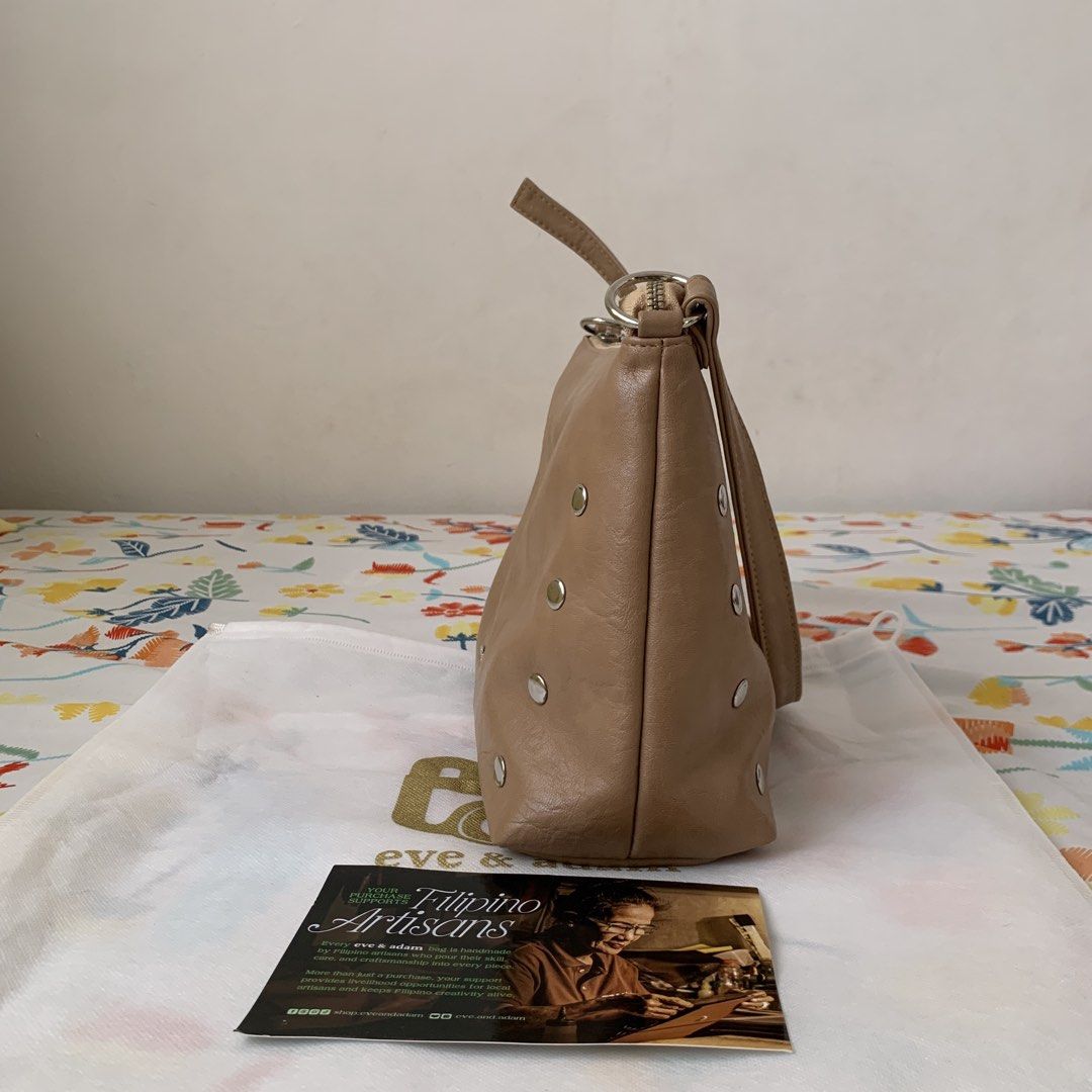 Eve & Adam Lia Studded Hobo Bag - Latte (Category: Shoulder Bags) located in Calamba. Submitted by capriciousss (Listing ID 1468305892, Image 3). Description: eve & adam lia studded hobo bag color: latte dimensions in inches: 12x4.25x8 with dust bag got it for P1,450 just recently no issues, barely used really good quality from a local brand in marikina soft leather material has studs padded bottom so it easily stands on surface adjustable strap 