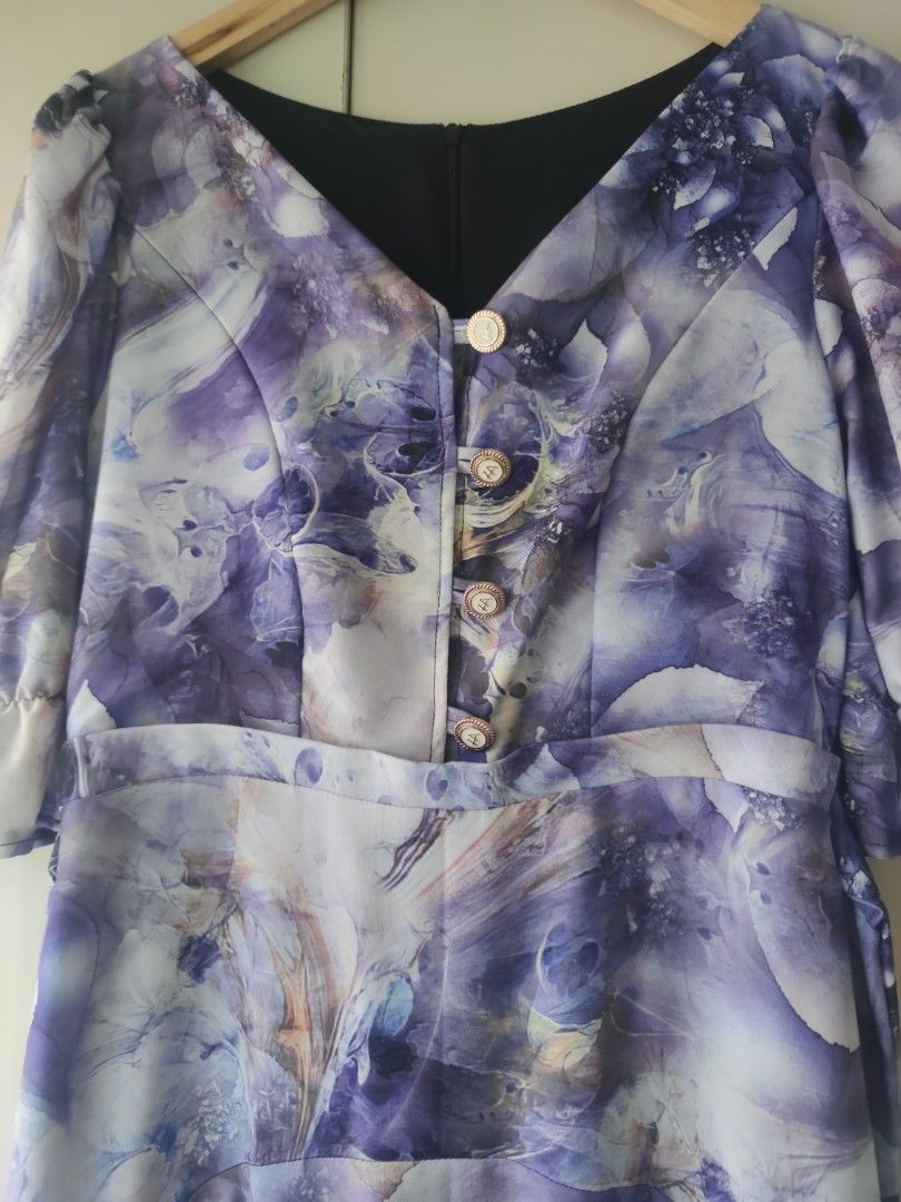 Everyday Hermana Edwina Dress (Category: Dresses) located in Bacolod City. Submitted by leighleigh17 (Listing ID 1468292806, Image 3). Description: - Brand: Everyday Hermana (Edwina dress) - Pattern/Color: Printed abstract violet - Style: Midi length, V-neckline with decorative gold buttons, fitted waist, flared skirt, and puff sleeves with gathered cuffs - Fabric: Lightweight with a smooth finish - Condition:like new b35 w30 L48 no pockets free 