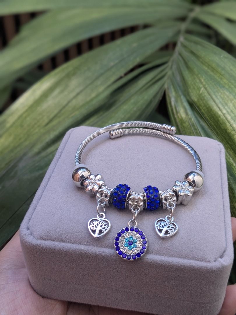 Evil Eye Charm Bracelet (Category: Bracelets) located in Quezon City. Submitted by nnncorner (Listing ID 1468445267, Image 3). Description: Evil Eye Silvertone Charm Bracelet New and velvet box included Fits 15-20 cm wrist Perfect for gifting Hypoallergenic Made in Korea Not lightweight Worn to show how it looks. 890.