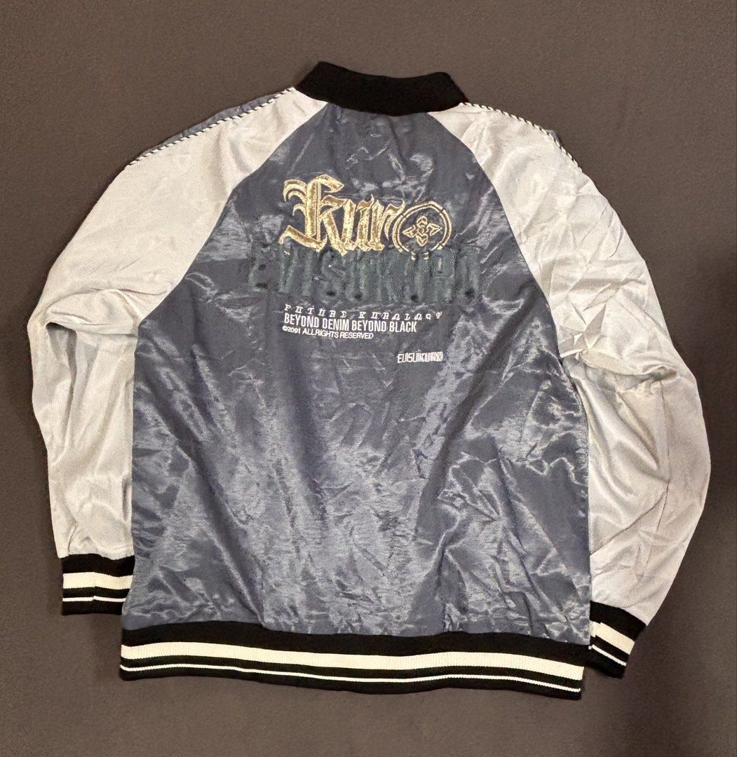 Evisu Kuro Bomber Jacket Grey White (Category: Coats, Jackets and Outerwear) located in Mabalacat. Submitted by _limitlessfashion (Listing ID 1468305398, Image 3). Description: - Brand: Evisu Kuro - Style: Bomber jacket in grey and white satin finish - Size large on tag - Length 27 - Width 23 - No issue, bnew condition - Condition: Brand new with tags still hanging from the zipper pull - Details: Full zip front, striped ribbed collar, cuffs, and 