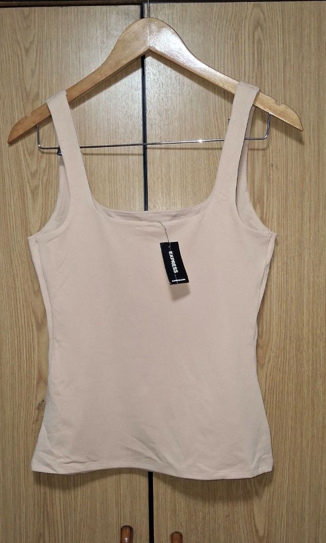Express Body Contours High compression Square neck Tank top (Category: Others Tops) located in Cebu City. Submitted by cebuanamomshies (Listing ID 1468290665, Image 3). Description: Medium Neutral/Nude A tank created to smooth, sculpt, and define your figure. This body contour top has a double lining of matte fabric and a flattering square neckline. Features & Fabric Matte fabric; Double layer of fabric in front and back 85% Polyester/15% Spandex