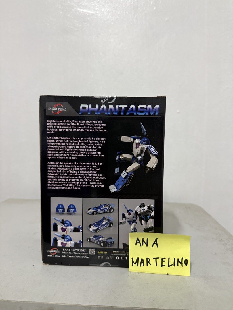 Fans Toys FT-49 Phantasm Transformers Masterpiece (Category: Figurines & Statues) located in Manila. Submitted by ana_banana011 (Listing ID 1468301365, Image 3). Description: - Brand: Fans Toys (FT-49 Phantasm) - Condition: Mint in box with original packaging, artwork, and character bio - Scale: Masterpiece scale collector figure - Mode: Fully converts between robot mode and detailed blue race car mode - Accessories: Includes interchangeable head