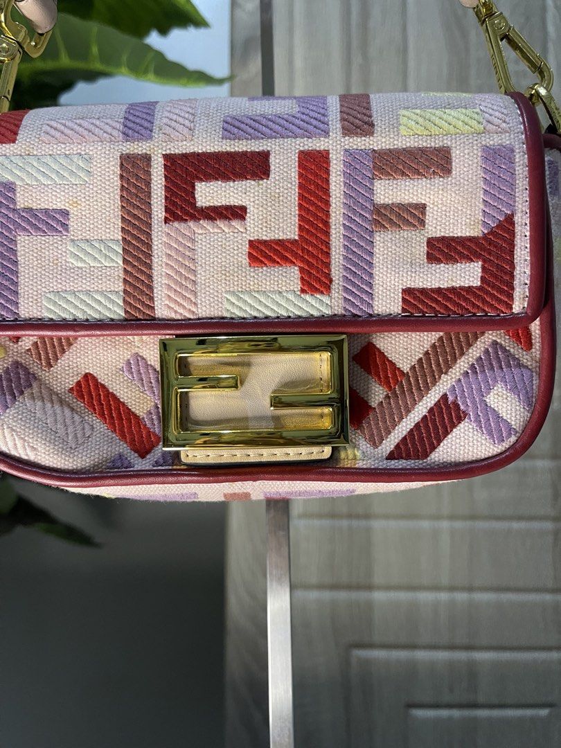 Fendi FF Zucca Embroidered Canvas Shoulder Bag (Category: Luxury Bags & Wallets) located in Dumaguete. Submitted by braveforest-2a12 (Listing ID 1468397914, Image 2). Description: - Authentic Fendi shoulder bag - Multi-color embroidered FF motif on canvas - Chic pink leather strap and red piping trim around the flap - Elegant gold-tone hardware - Short handle design with convenient lobster clasp closures.