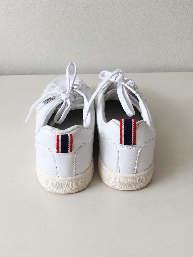 Fila White Casual Sneakers (Category: Sneakers) located in Manila. Submitted by maxinesotto (Listing ID 1468309644, Image 3). Description: - Brand: Fila - Style: Classic white leather sneakers with iconic blue and red logo plate - Size: US 6 / EUR 36.5 - Features: Lace-up closure, striped pull tab at the heel, and grippy rubber sole - Condition: Clean upper, versatile everyday kicks - Mode of Payment: GCash, BPI, or BDO - Shipping: Via J&T Expres