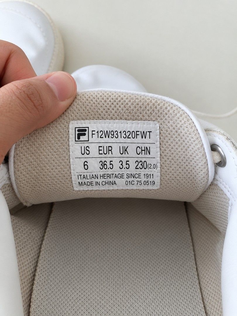 Fila White Casual Sneakers (Category: Sneakers) located in Manila. Submitted by maxinesotto (Listing ID 1468309644, Image 2). Description: - Brand: Fila - Style: Classic white leather sneakers with iconic blue and red logo plate - Size: US 6 / EUR 36.5 - Features: Lace-up closure, striped pull tab at the heel, and grippy rubber sole - Condition: Clean upper, versatile everyday kicks - Mode of Payment: GCash, BPI, or BDO - Shipping: Via J&T Expres