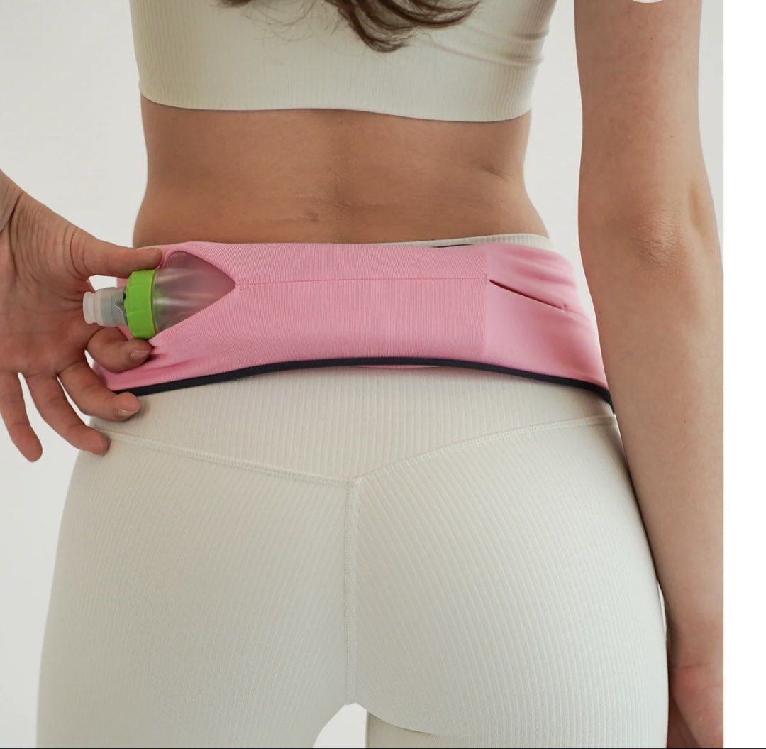 FlipBelt Pink Running Belt with Key Hook (Category: Activewear) located in Cagayan de Oro. Submitted by aljay02 (Listing ID 1468392735, Image 1). Description: - Color: Bright pink with silver reflective branding - Size: 14 to 15 inches flat across (unstretched with great stretch) - Storage: Multiple secure slit pockets for phone and essentials - Extras: Attached black key hook on an elastic cord - Condition: Clean fabric, perfect for hands-free r