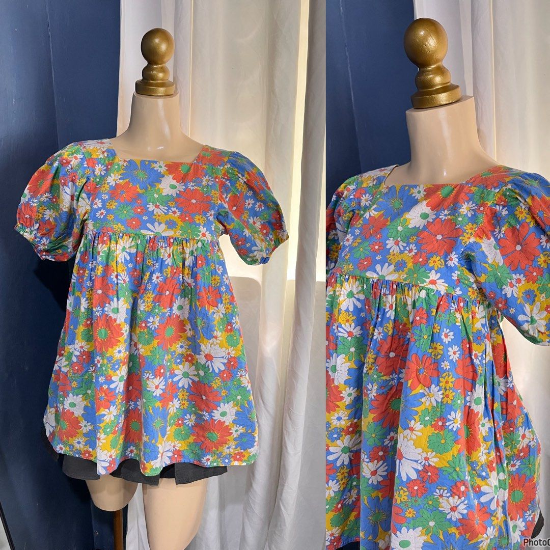 Floral Print Square Neck Puff Sleeve Top (Category: Babies & Kids Fashion) located in Valencia. Submitted by kathrift (Listing ID 1468424243, Image 1). Description: - Vibrant multi-color floral print (red, blue, green, and yellow) - Trendy square neckline with short puff sleeves - Comfortable loose babydoll silhouette with a gathered waistline - Fun and easy statement piece to throw on with jeans or shorts.