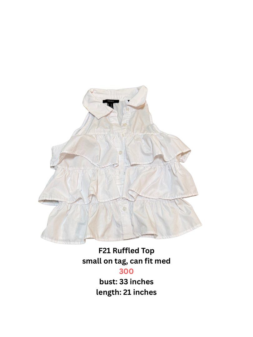 Forever 21 White Ruffled Sleeveless Top (Category: Sleeveless) located in Angeles City. Submitted by vega.rachel (Listing ID 1468284982, Image 1). Description: - Brand: Forever 21 - Color: White - Size: Tag says Small, fits Medium as well - Design: Multi-tiered ruffles, button-up front, and classic collar - Measurements: Bust 33" | Length 21" - Condition: Great, versatile piece easily styled for casual or formal wear.