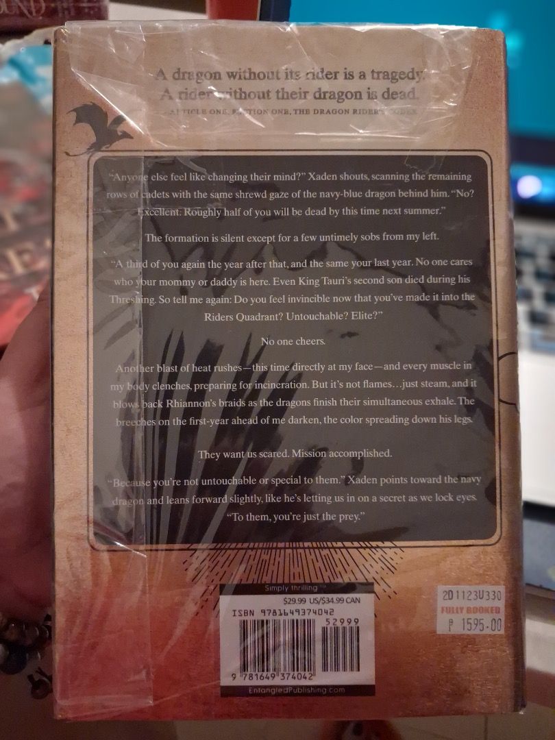 Fourth Wing Book Entangled Publishing (Category: Storybooks) located in Cebu City. Submitted by bettzy77 (Listing ID 1468480643, Image 2). Description: - Format: Hardcover fantasy novel (ISBN: 9781649374042) - Condition: Brand new and sealed in original plastic wrapping - Price Tags: Original printed prices ($29.99 USD / $34.99 CAD) with Fully Booked store price sticker of ₱1,595 attached - Special Details: Dragon rider quote printed on the top b