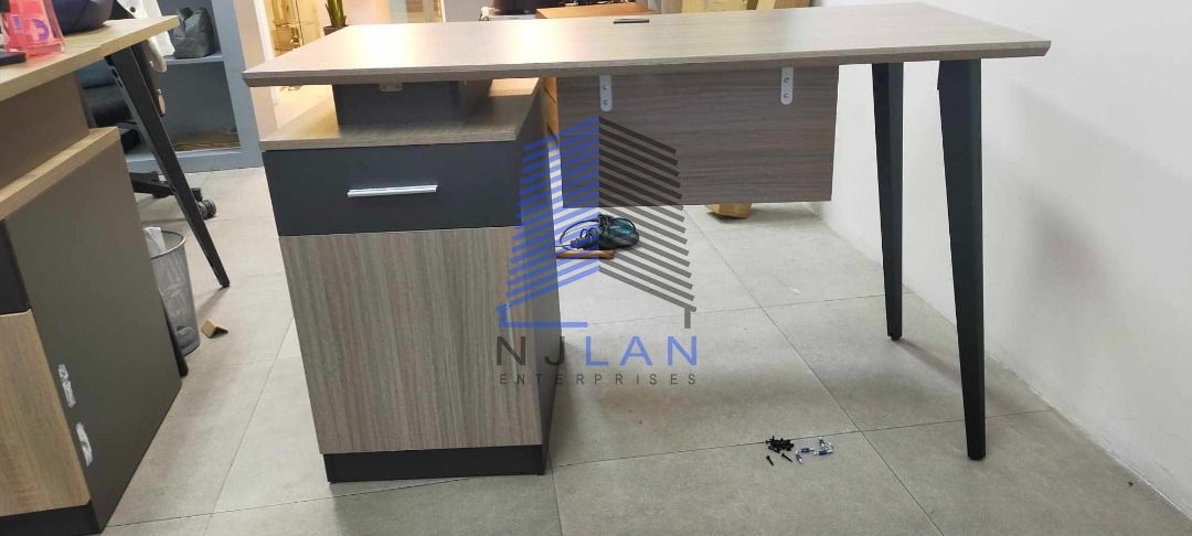 Freestanding Table (Category: Office Furniture & Fixtures) located in Caloocan City. Submitted by boldwind_7b70cf (Listing ID 1468288334, Image 1). Description: Freestanding Table Wood top & Gray Wood modesty2 tone finish on side drawer/cabinet Powder coated Steel Legs Color: GRAY or BROWN.
