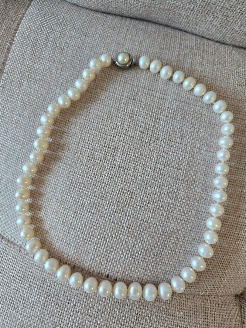 Fresh Water Pearl Necklace (Category: Necklaces) located in Manila. Submitted by luxtimeless (Listing ID 1468355539, Image 1). Description: - Classic white pearl necklace in standard choker size - Features individual knots between each round pearl for safety and elegance - Beautiful luster with a clean, polished look - Secure side clasp closure for easy wearing - Versatile design matches both casual and formal outfits.