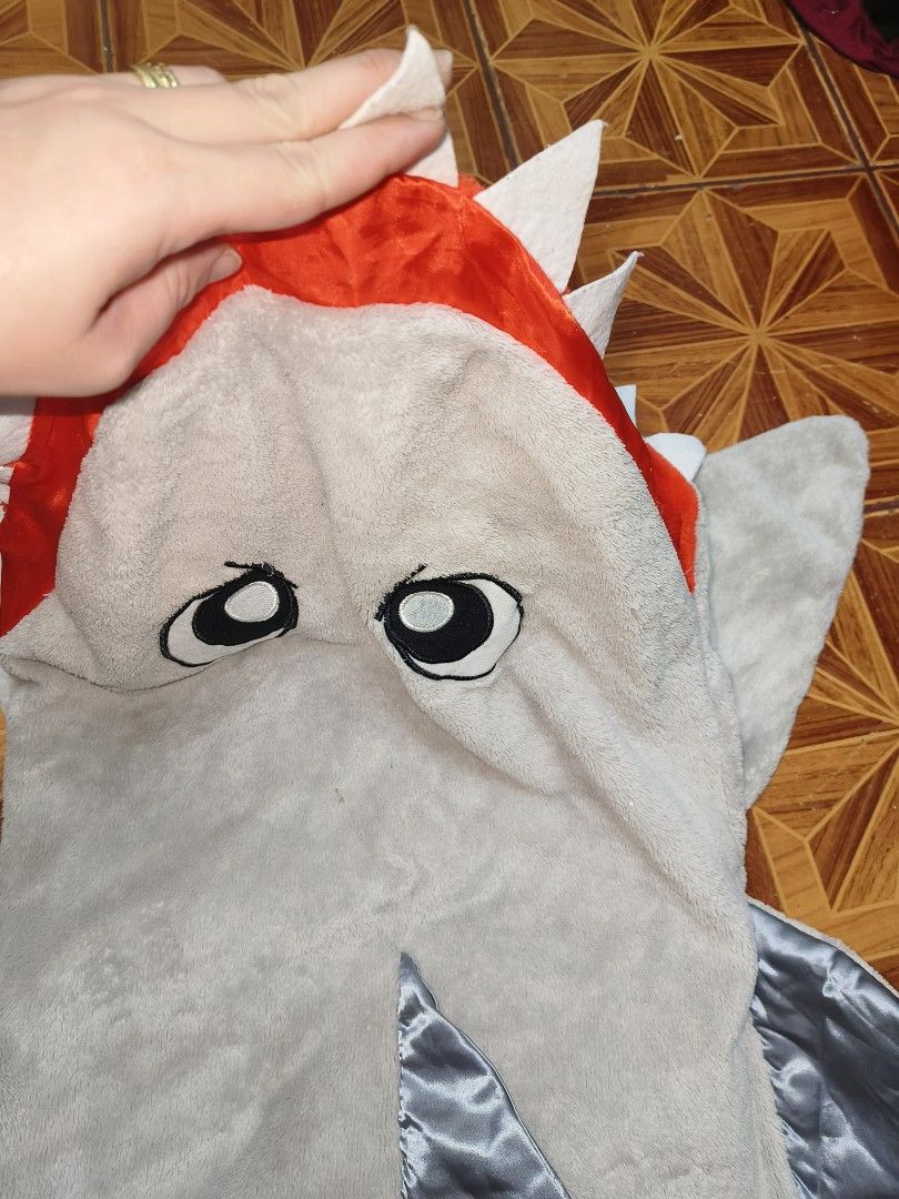 FS Shark wearable blanket for 5-8 yrs old (Category: Babies & Kids Fashion) located in Manila. Submitted by jewfindshop (Listing ID 1468340938, Image 3). Description: - Adorable shark wearable blanket for kids aged 5 to 8 years old - Made from ultra-soft and cozy light grey fleece material - Features a fun bright orange inner mouth with white felt teeth - Complete with eye-catching shiny silver fins and tail - Versatile hoodie style, perfect for 