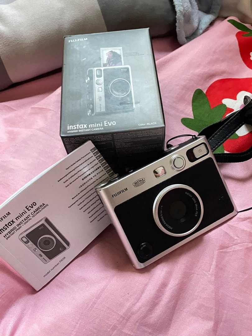 FUJI FILM MINI EVO (Category: Cameras) located in Manila. Submitted by annievey (Listing ID 1468444563, Image 2). Description: FS ❕ FS ❕ FS ❕ FS ❕ Instax mini evo fuji film (black) Original price: 12,999 Price fs: 10,500 — negotiable for sure buyer 🥺🥺 No functional issue, may mga minimal scratch lang sa malapitan lang sya visible 😄 all goods pa talaga, almost a year and a half months palang sakin. Inclusion: camera, lace, box and 30gb SD card 
