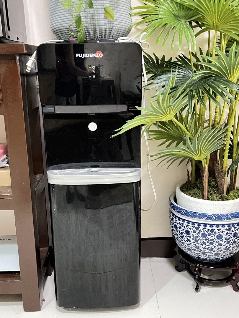Fujidenzo Water Dispenser (Category: Water Purifiers & Dispensers) located in Manila. Submitted by danosaurrr (Listing ID 1468302862, Image 2). Description: 💧 FUJIDENZO FWD1031B WATER DISPENSER FOR SALE! 💰 Price: ₱2,500 Black, free-standing, top-load water dispenser with 3 water options: Hot, Cold, and Warm! Features an energy-efficient compressor, child safety lock for hot water, and double safety protection against overheating.